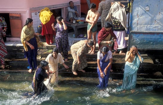 Hindi Pilgrim take a Bath in the Ganges River in the city of Haridwar in the Province Uttarakhand in India.  India, Haridwar, April, 1998