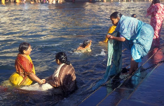 Hindi Pilgrim take a Bath in the Ganges River in the city of Haridwar in the Province Uttarakhand in India.  India, Haridwar, April, 1998