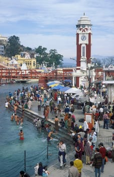 a view over public aerea with the Clock Tower at the Holy Ganges River in the city of Haridwar in the Province Uttarakhand in India.  India, Haridwar, February, 1998