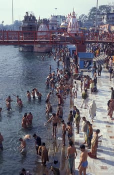 Hindi Pilgrim take a Bath in the Ganges River in the city of Haridwar in the Province Uttarakhand in India.  India, Haridwar, April, 1998