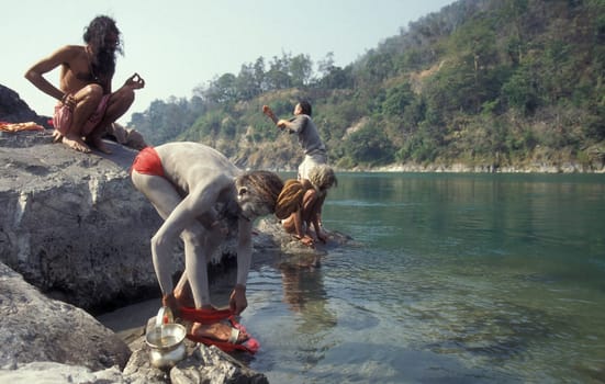 a Holy men and Street Sadhus at the Holy Ganges River in the city of Rishikesh in the Province Uttarakhand in India.  India, Rishikesh, February, 1998