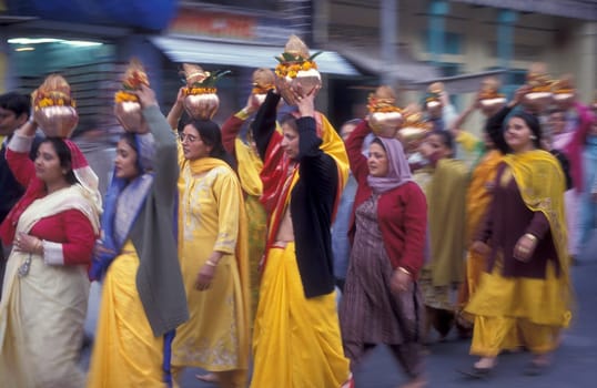 Hindi Pilgrim at a ceremony at the Holy Ganges River in the city of Haridwar in the Province Uttarakhand in India.  India, Haridwar, February, 1998