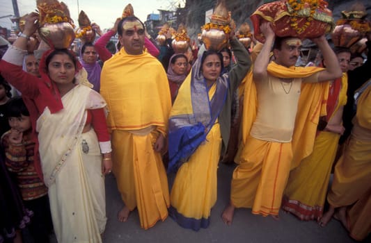 Hindi Pilgrim at a ceremony at the Holy Ganges River in the city of Haridwar in the Province Uttarakhand in India.  India, Haridwar, February, 1998