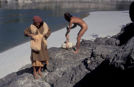 a Holy men and Street Sadhus at the Holy Ganges River in the city of Rishikesh in the Province Uttarakhand in India.  India, Rishikesh, February, 1998