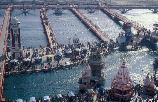 a view over public aerea with the Clock Tower at the Holy Ganges River in the city of Haridwar in the Province Uttarakhand in India.  India, Haridwar, February, 1998