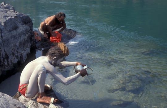 a Holy men and Street Sadhus at the Holy Ganges River in the city of Rishikesh in the Province Uttarakhand in India.  India, Rishikesh, February, 1998