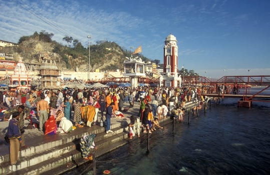 Hindi Pilgrim take a Bath in the Ganges River in the city of Haridwar in the Province Uttarakhand in India.  India, Haridwar, February, 1998