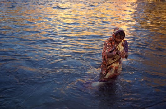 Hindi Pilgrim take a Bath in the Ganges River in the city of Haridwar in the Province Uttarakhand in India.  India, Haridwar, April, 1998