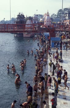 Hindi Pilgrim take a Bath in the Ganges River in the city of Haridwar in the Province Uttarakhand in India.  India, Haridwar, April, 1998