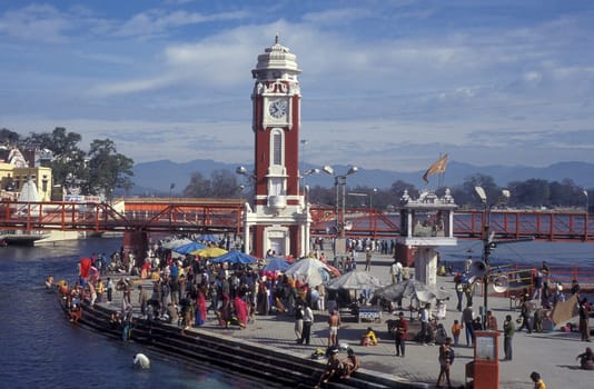 a view over public aerea with the Clock Tower at the Holy Ganges River in the city of Haridwar in the Province Uttarakhand in India.  India, Haridwar, February, 1998