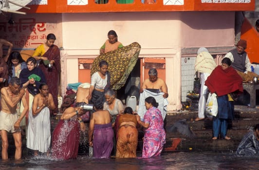 Hindi Pilgrim take a Bath in the Ganges River in the city of Haridwar in the Province Uttarakhand in India.  India, Haridwar, April, 1998