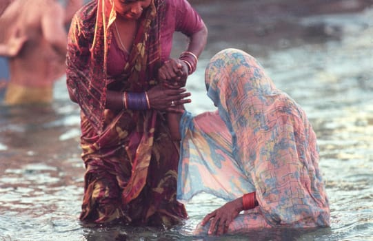 Hindi Pilgrim take a Bath in the Ganges River in the city of Haridwar in the Province Uttarakhand in India.  India, Haridwar, February, 1998