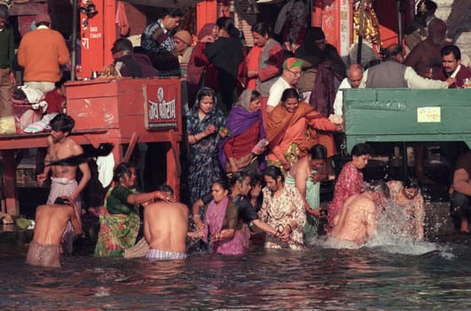 Hindi Pilgrim take a Bath in the Ganges River in the city of Haridwar in the Province Uttarakhand in India.  India, Haridwar, February, 1998