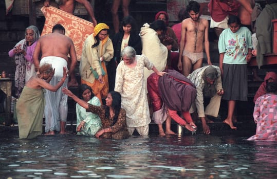 Hindi Pilgrim take a Bath in the Ganges River in the city of Haridwar in the Province Uttarakhand in India.  India, Haridwar, February, 1998