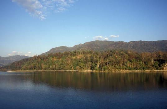 the Holy Ganges River with the city of Rishikesh in the Province Uttarakhand in India.  India, Rishikesh, February, 1998