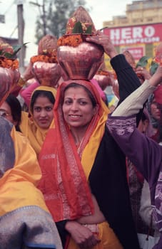 Hindi Pilgrim at a ceremony at the Holy Ganges River in the city of Haridwar in the Province Uttarakhand in India.  India, Haridwar, February, 1998