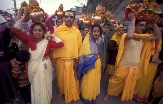 Hindi Pilgrim at a ceremony at the Holy Ganges River in the city of Haridwar in the Province Uttarakhand in India.  India, Haridwar, February, 1998
