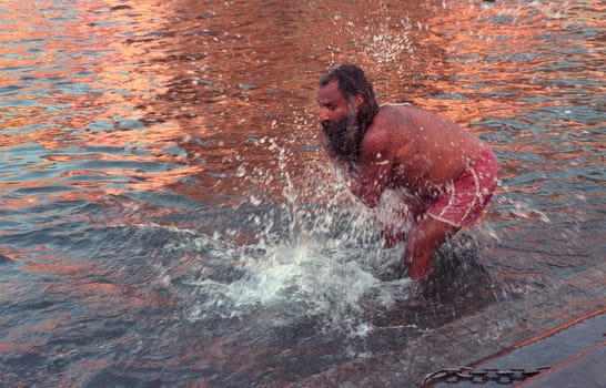 Hindi Pilgrim take a Bath in the Ganges River in the city of Haridwar in the Province Uttarakhand in India.  India, Haridwar, February, 1998