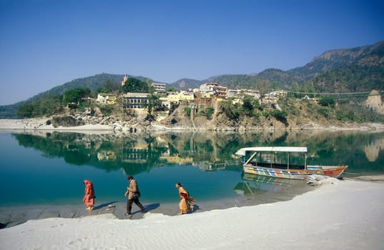the Holy Ganges River with the city of Rishikesh in the Province Uttarakhand in India.  India, Rishikesh, February, 1998
