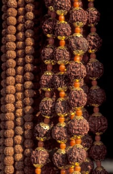 a Rudraksha chain at a market in the city of Rishikesh in the Province Uttarakhand in India.  India, Rishikesh, February, 1998