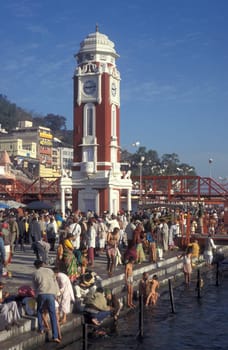 a view over public aerea with the Clock Tower at the Holy Ganges River in the city of Haridwar in the Province Uttarakhand in India.  India, Haridwar, February, 1998