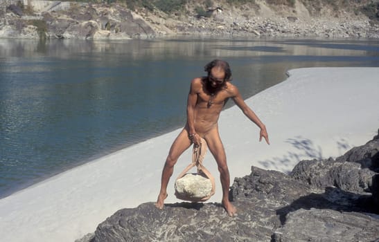 a Holy men and Street Sadhus at the Holy Ganges River in the city of Rishikesh in the Province Uttarakhand in India.  India, Rishikesh, February, 1998