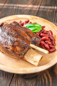 Glazed cooked pork hock with kidney beans