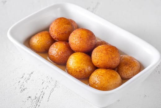 Gulab jamun indian dessert soaked in syrup