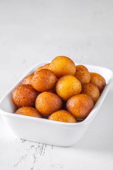 Gulab jamun indian dessert soaked in syrup