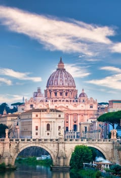 ROME, ITALY - JUNE 2023: Tiber river bridge with Vatican City and dome of Saint Peter Cathedral