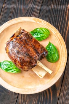 Glazed cooked pork hock on the plate