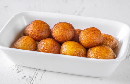Gulab jamun indian dessert soaked in syrup