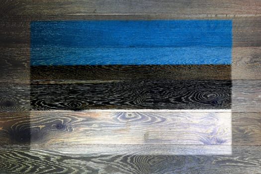 An Estonia flag on rustic old wood surface background