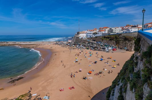Sintra, Portugal: April 13, 2024: People at the beach of Praia dos Pescadores, Mafra, Portugal