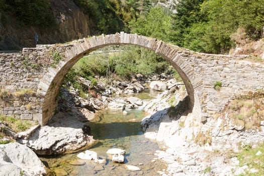 Ancient Roman bridge along the road to Anso, Spain. Ordesa valley landmark