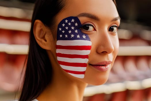 Close-up of the face of a female fan in a sports stadium, with an American flag painted on one side of her face.