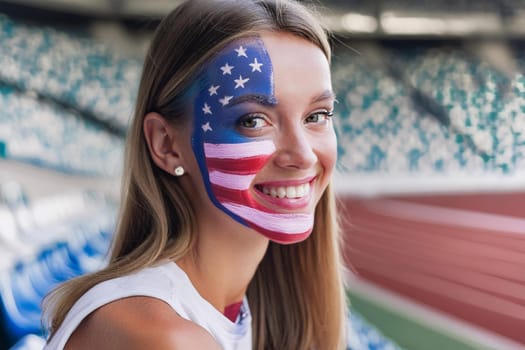Joyful fan young woman on a sport stadium. Flag of USA on her face.