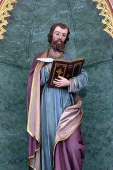 Saint Luke the Evangelist, statue on the High altar in the parish church of Saint Luke in Lukac, Croatia