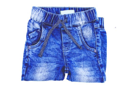 Jeans isolated. Trendy stylish blue denim pants or trousers for child boy isolated on a white background. Clipping path. Jeans winter and autumn fashion.