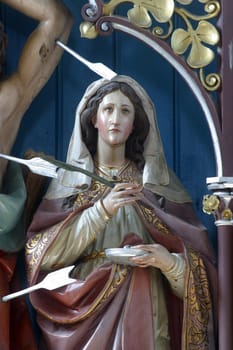 Saints Lucia, statue on the altar of Saints Fabian and Sebastian at Our Lady of Miracles Parish Church in Ostarije, Croatia