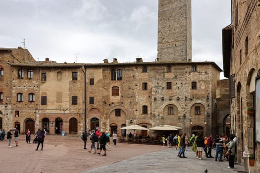 San Gimignano, Italy - Sept 17, 2022: Piazza della Cisterna in San Gimignano, Tuscany, Italy