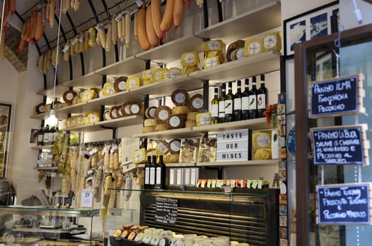 San Gimignano, Italy - Sept 17, 2022: A shop selling local and typical italian produce in the historic center of San Gimignano, Tuscany.