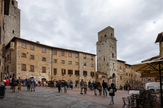 San Gimignano, Italy - Sept 17, 2022: Piazza della Cisterna in San Gimignano, Tuscany, Italy