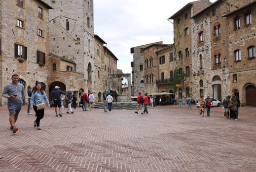 San Gimignano, Italy - Sept 17, 2022: Piazza della Cisterna in San Gimignano, Tuscany, Italy