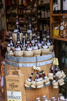 San Gimignano, Italy - Sept 17, 2022: A shop selling local and typical italian produce in the historic center of San Gimignano, Tuscany.