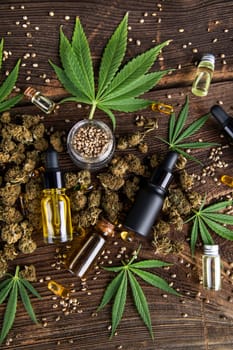 Hemp oil and marijuana leaves on extract cbd