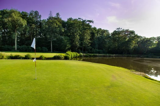 Golf course with green grass