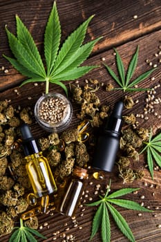 Hemp oil and marijuana leaves on extract cbd