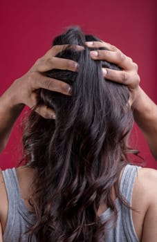 black man's hands are gently holding the head of a white woman with long, tied-back hair. The image symbolizes inclusivity, gender fluidity, non-binarism, and LGBTQIA+ values