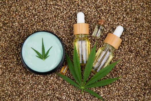 Cbd oil and marijuana plant, hemp seeds, medical marijuana concept